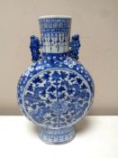 A Chinese glazed blue and white moon flask vase, height 25cm.