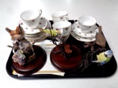 A tray of seventeen pieces of pink rose pattern bone tea china and four ceramic bird figures with
