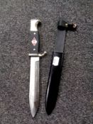 A reproduction German dagger in sheath