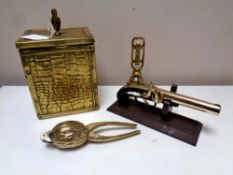 A vintage pistol lighter on stand together with brass tea caddy, unusual brass walnut nut cracker,