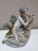 A Lladro figure : Boy with flute