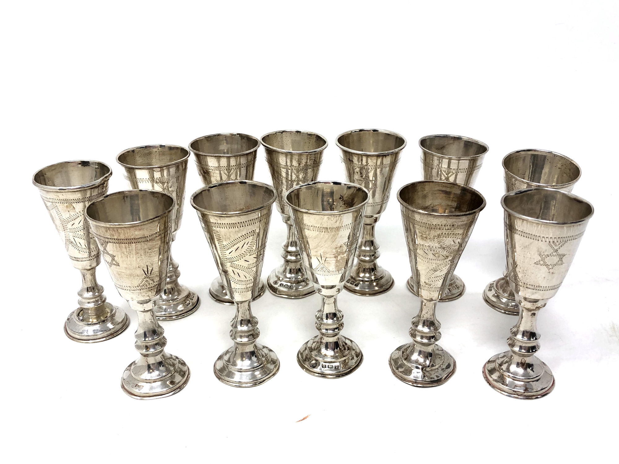 Twelve silver miniature Kiddush cups