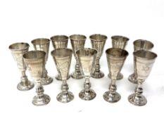 Twelve silver miniature Kiddush cups