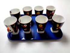 A set of eight Wedgwood Clarice Cliff Age of Jazz Art Deco mugs