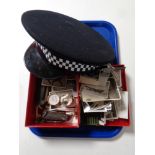 A tray containing miscellaneous to include policeman's hat, vintage pocket knives, glass eye,