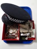 A tray containing miscellaneous to include policeman's hat, vintage pocket knives, glass eye,