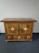A Barker and Stonehouse flagstone double door sideboard fitted three drawers beneath