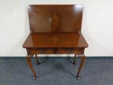 A walnut turnover top console table fitted two drawers on Queen Anne legs