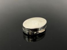 A chrome plated pill box