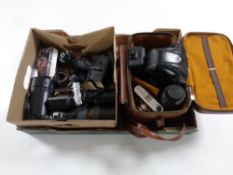 A box containing Cosina and Colora cameras together with assorted lenses and accessories