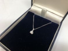 A 9ct white gold diamond set pendant on 9ct white gold chain