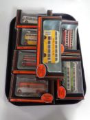 A tray containing seven exclusive first edition die cast buses (boxed)
