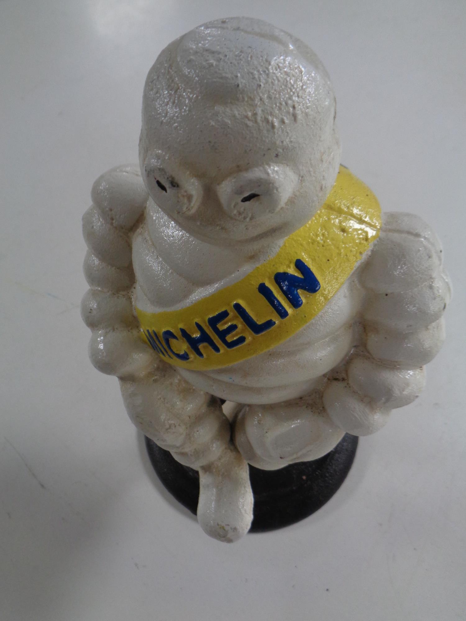 A cast iron figure - Seated Michelin man