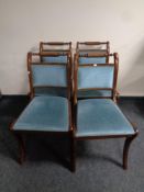 A set of four reproduction Regency style dining chairs