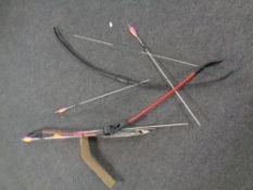 Two archery bows with arrows