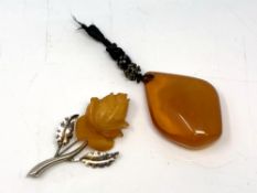 An amber pendant and an .835 silver mounted brooch stamped SBM.