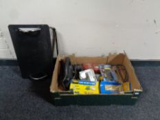 A box containing power tools to include a Hilti 110V drill, hand held saw,