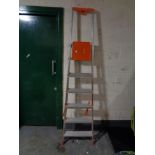 A pair of six tread folding aluminium ladders