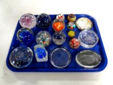 A tray containing 17 assorted glass and resin paperweights to include Queen Elizabeth SIlver