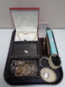 A tray containing costume jewellery, necklaces, earrings,