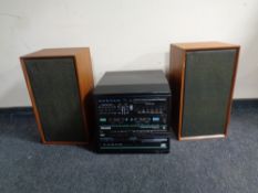 A pair of 20th century teak cased Dynatron LS1434 speakers together with a Phillips hifi