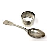 A Victorian silver spoon and a silver napkin ring. CONDITION REPORT: 50.5g.
