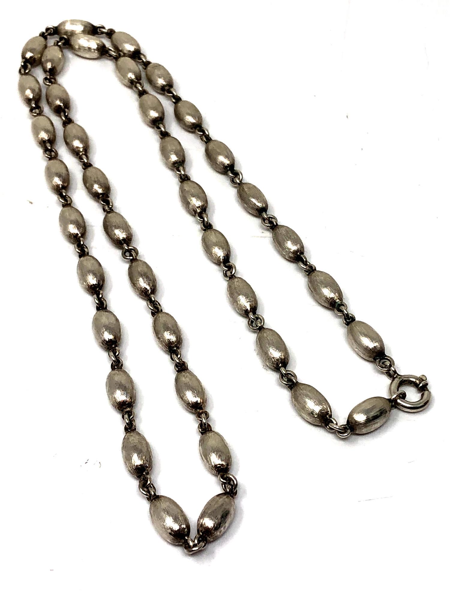 A silver bead necklace. CONDITION REPORT: 35.