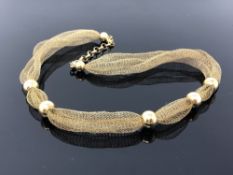 A gold plated on silver ball necklace