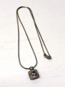 An 18ct white gold topaz pendant on matching chain. CONDITION REPORT: 6.2g gross.