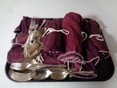 A quantity of Walker and Hall plated cutlery in cloth rolls