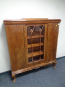 An early 20th century mahogany bookcase fitted with three doors