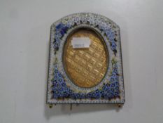 A late 19th century Venetian mosaic photo frame decorated with flowers 19 cm x 11.