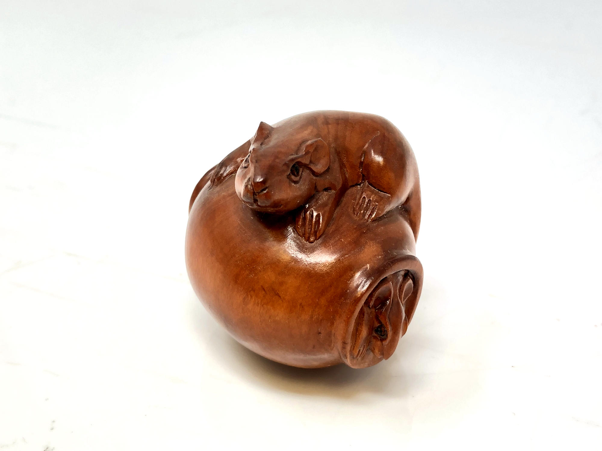 A carved Chinese wooden netsuke,