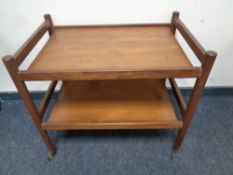 A 20th century teak two tier serving trolley