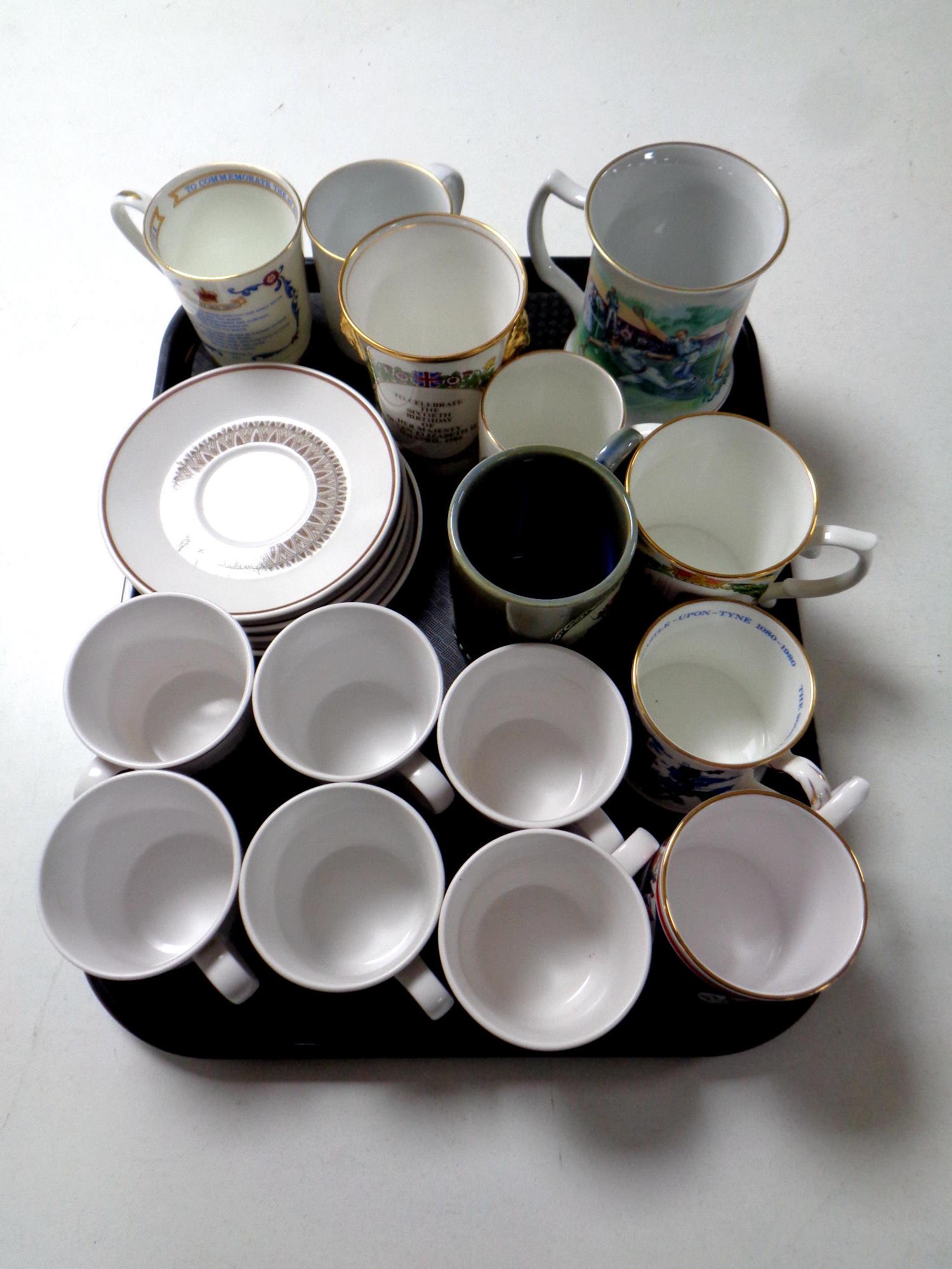 A tray containing a quantity of commemorative and centenary tankards and mugs,