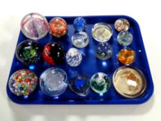 A tray containing 17 assorted glass paperweights to include V Mason and C Murano Italy,