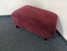 An oversized footstool upholstered in a purple fabric CONDITION REPORT: This does