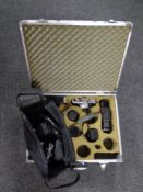 An aluminium camera case containing Olympus OM1 camera with accessories together with a further