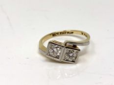 An antique 18ct gold two stone diamond crossover ring, each stone approx. 0.3 carat, size M.