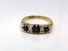 An 18ct gold sapphire and diamond ring, size K.