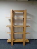 A set of contemporary oak open bookshelves