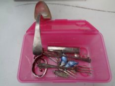 A box containing miscellaneous silver items to include a scrap silver serving spoon,