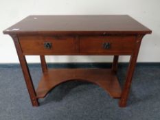 A contemporary Art & Crafts style two drawer dressing table with stool (no mirror)