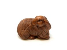 A carved Chinese wooden netsuke,