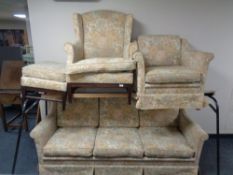 A 20th century four piece lounge suite upholstered in a floral fabric