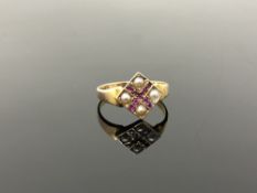 A 15ct gold ruby and seed pearl ring