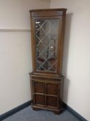 A leaded glass door corner display cabinet,