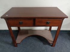 A contemporary Art & Crafts style two drawer dressing table with stool (no mirror)