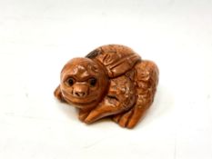 A carved Chinese wooden netsuke,