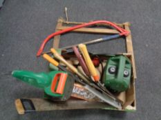 A box containing a Migatronic one 10V pump, electric hedge trimmer (continental wiring),